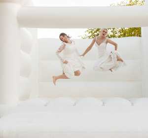 Stunning couple celebrate on a bouncy castle | Vaulty Manor | Essex